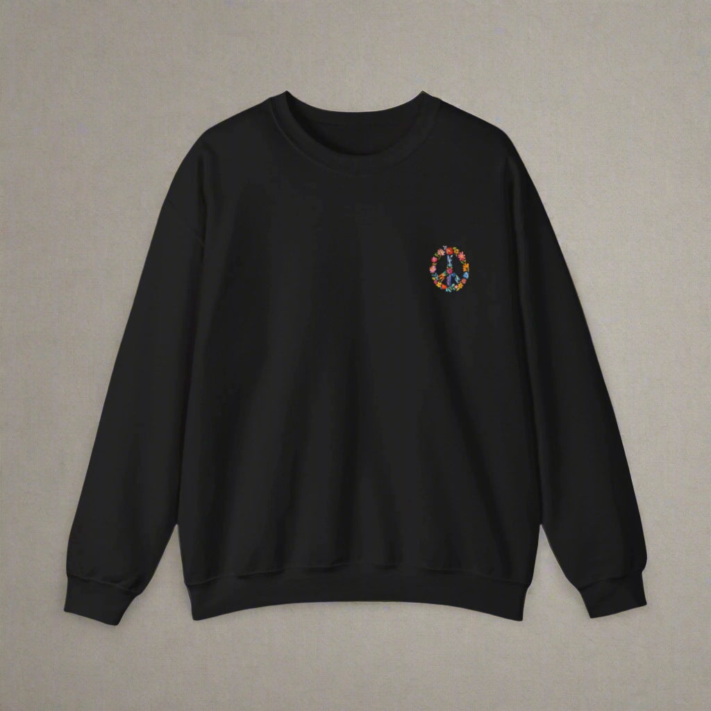 Black sweatshirt with a colorful peace symbol on the chest against a white background