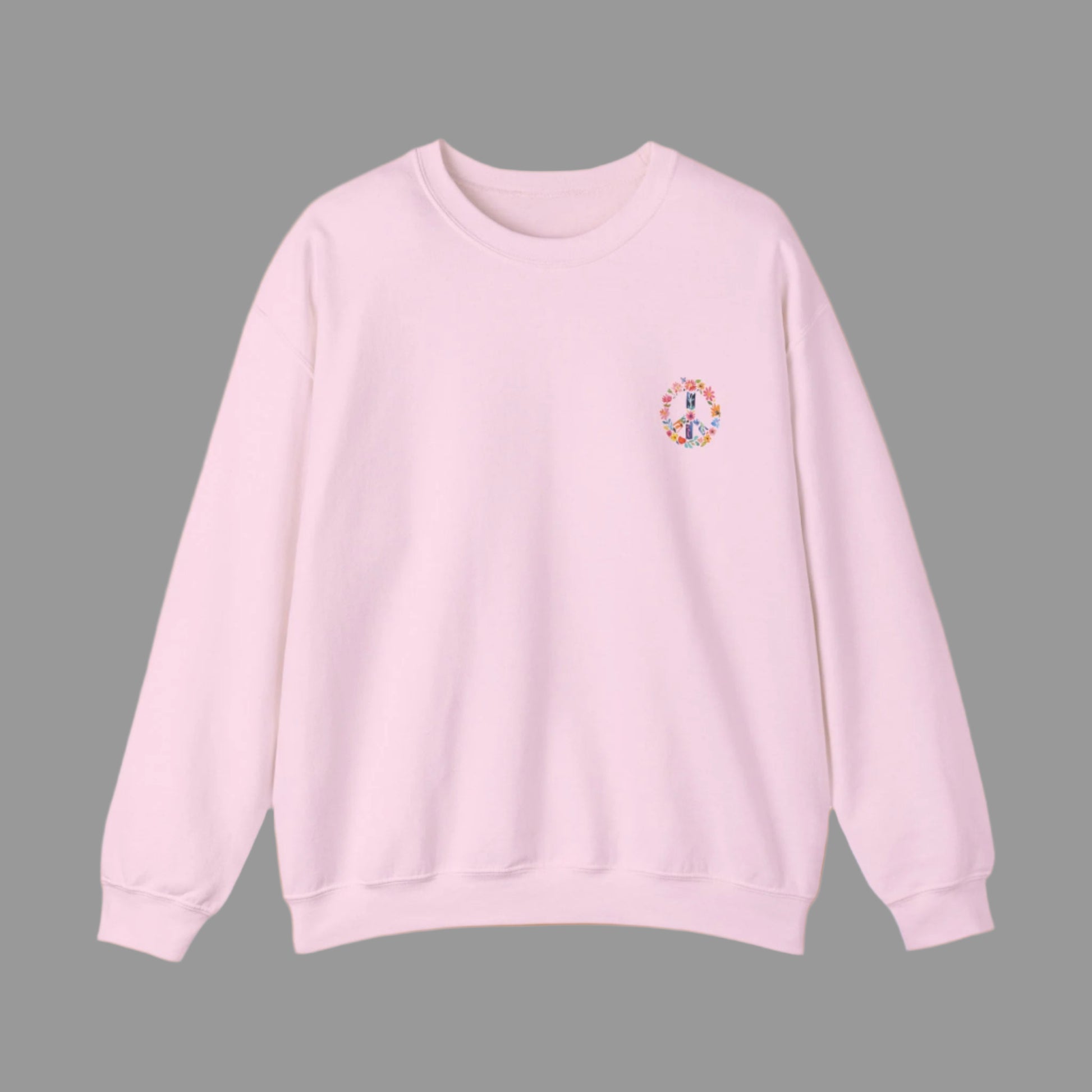 Pink sweatshirt with a colorful peace symbol on a white background