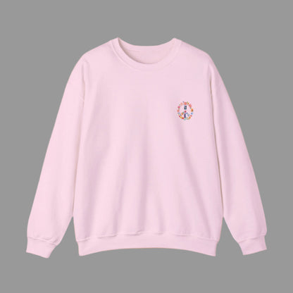 Pink sweatshirt with a colorful peace symbol on a white background