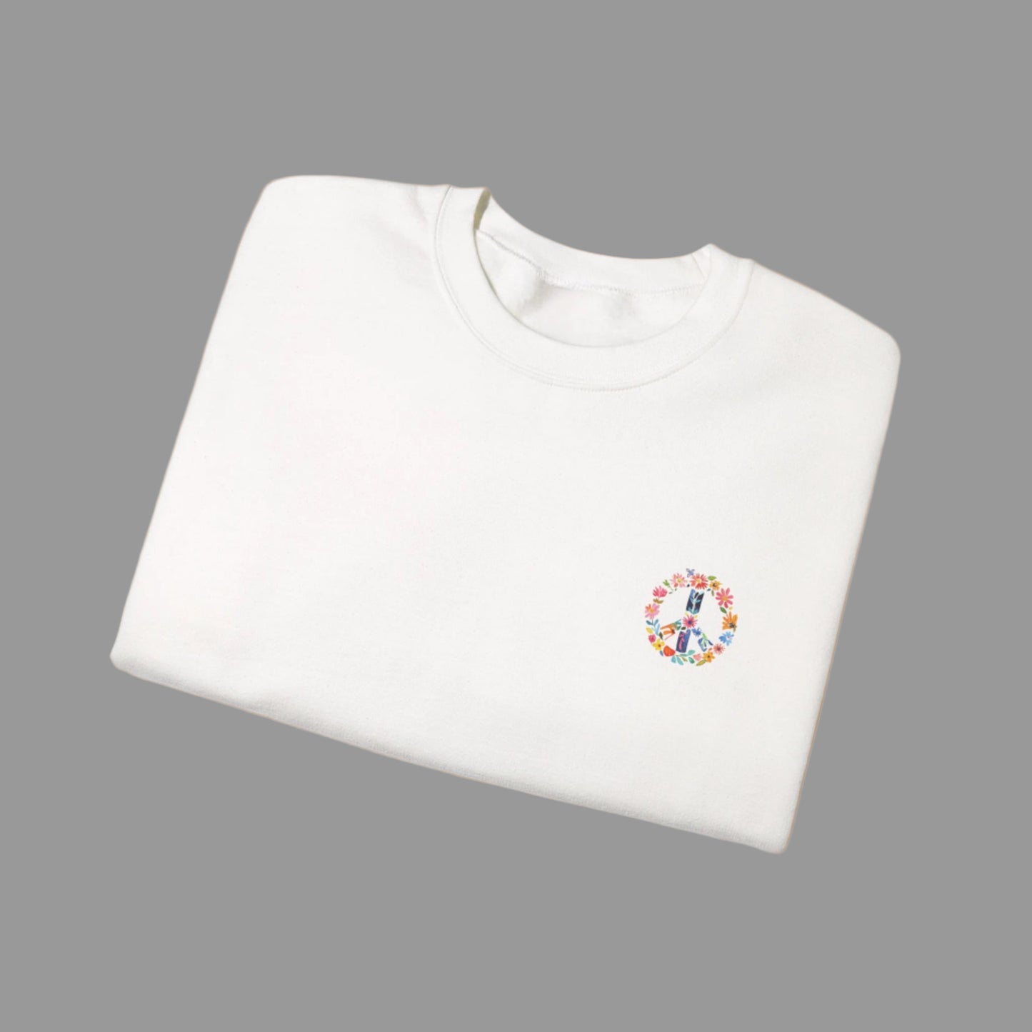 White sweatshirt with a colorful peace symbol design on a white background