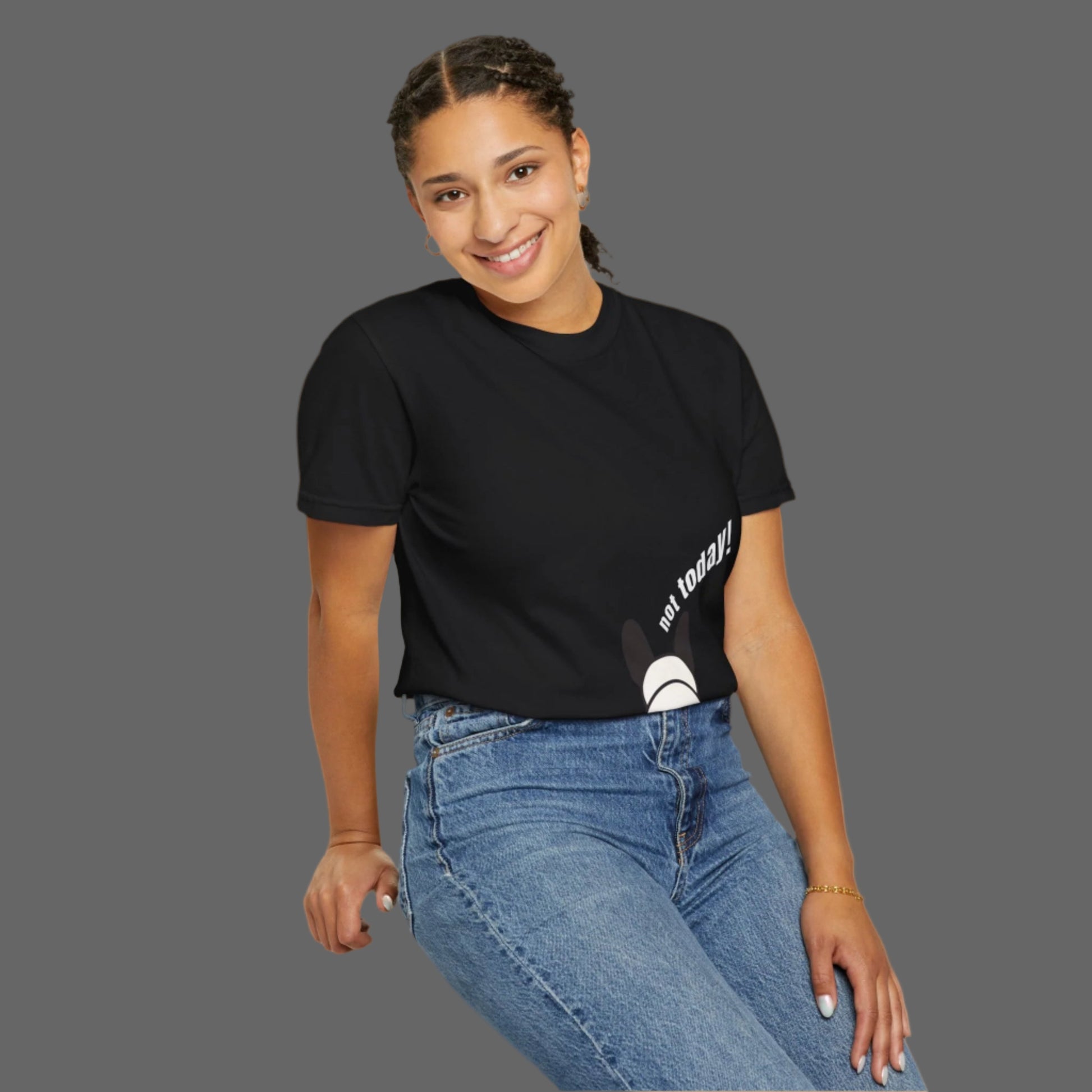 Person wearing a black t-shirt with text and blue jeans on a white background