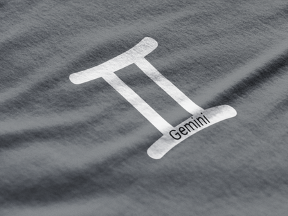 White Gemini zodiac symbol on a textured gray background