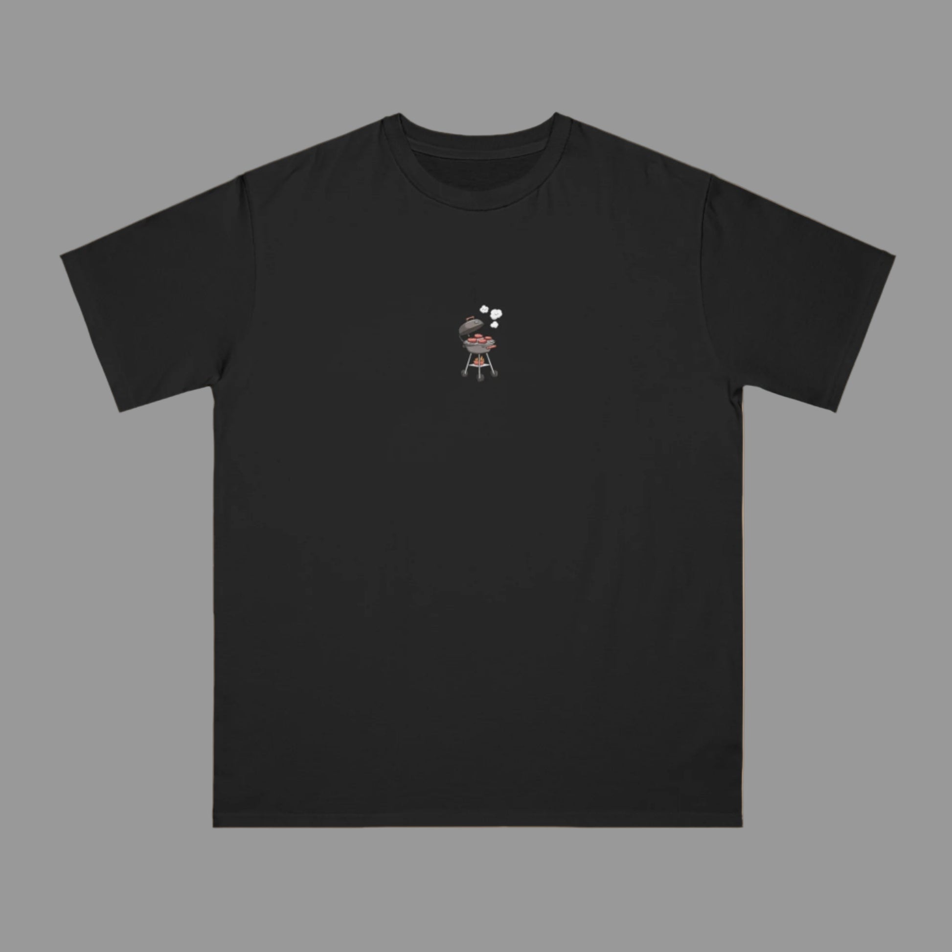 Black t-shirt with a small graphic on a beige background