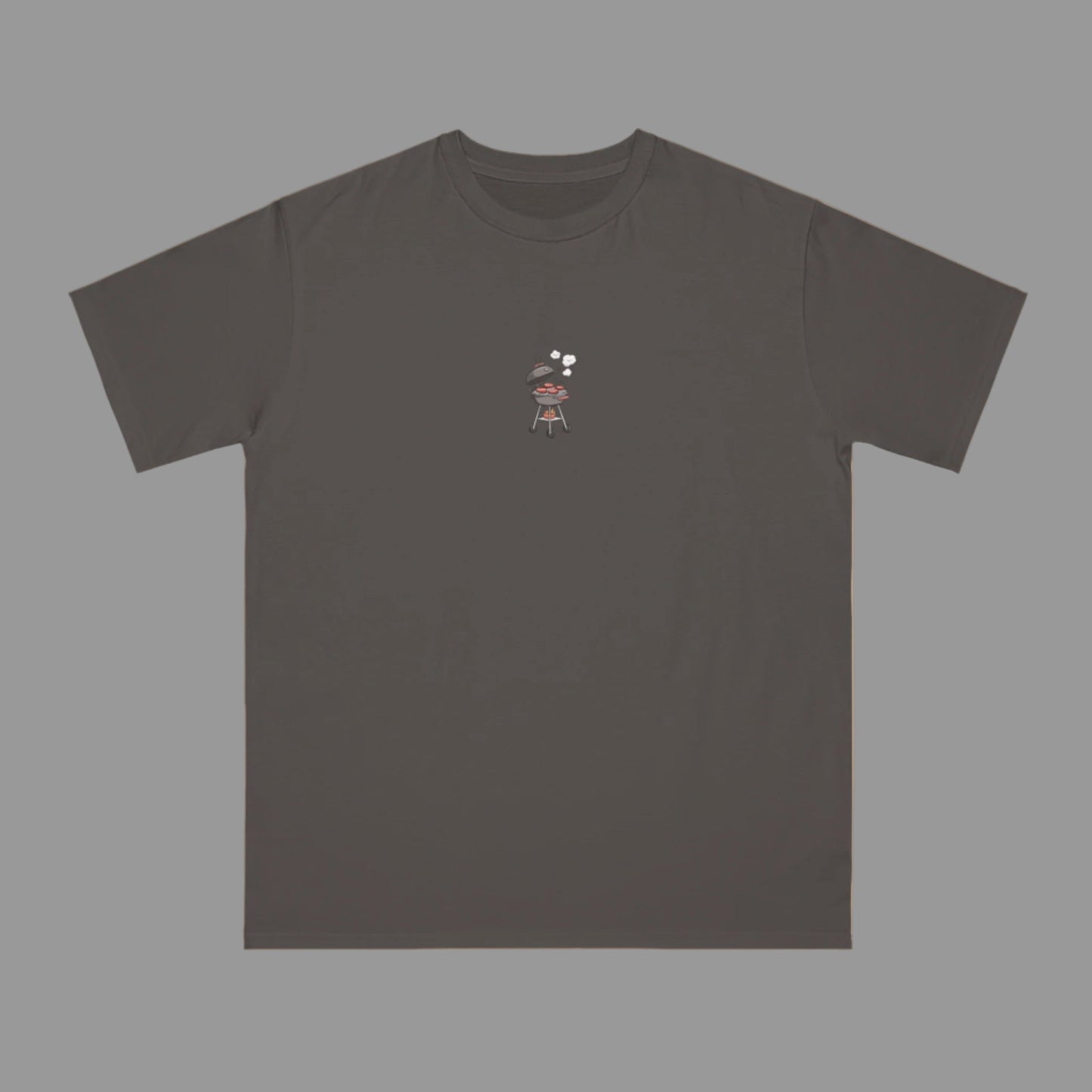 Dark gray t-shirt with a small graphic on a beige background