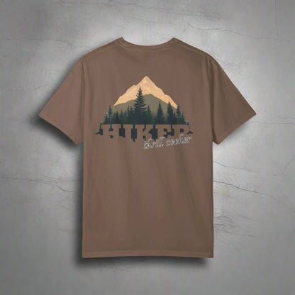 Brown t-shirt with a mountain and tree graphic on the back, on a white background