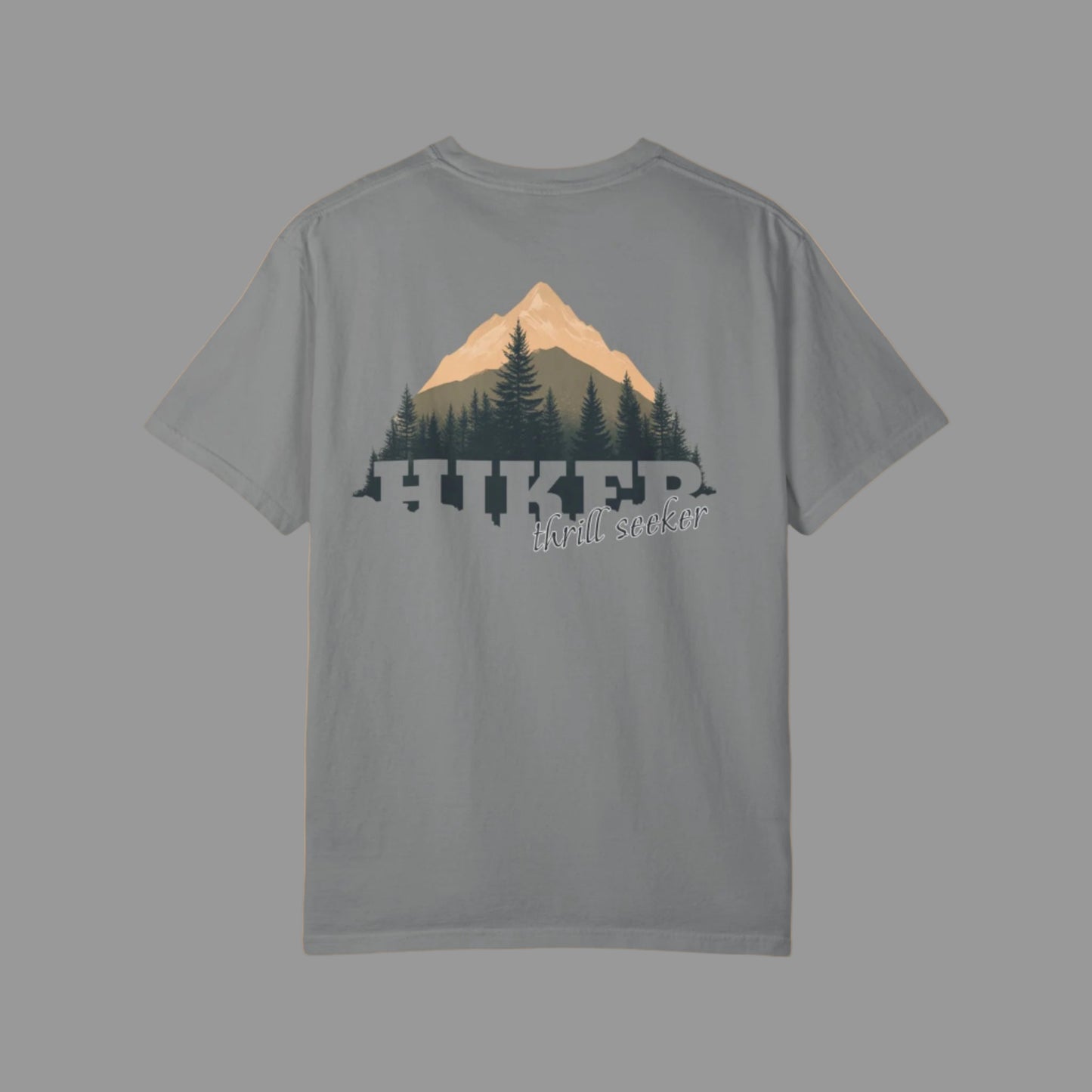 Gray t-shirt with mountain and tree design on the back, on a white background