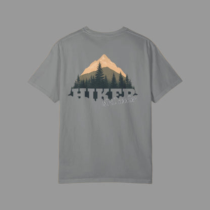 Gray t-shirt with mountain and tree design on the back, on a white background