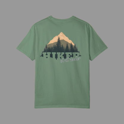 Green t-shirt with mountain and tree design on a white background