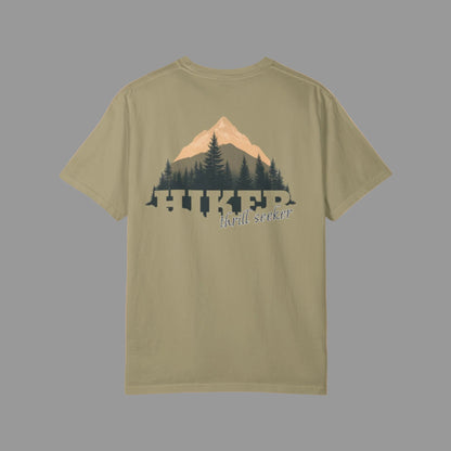 Olive green t-shirt with a mountain and tree design on the back, on a white background