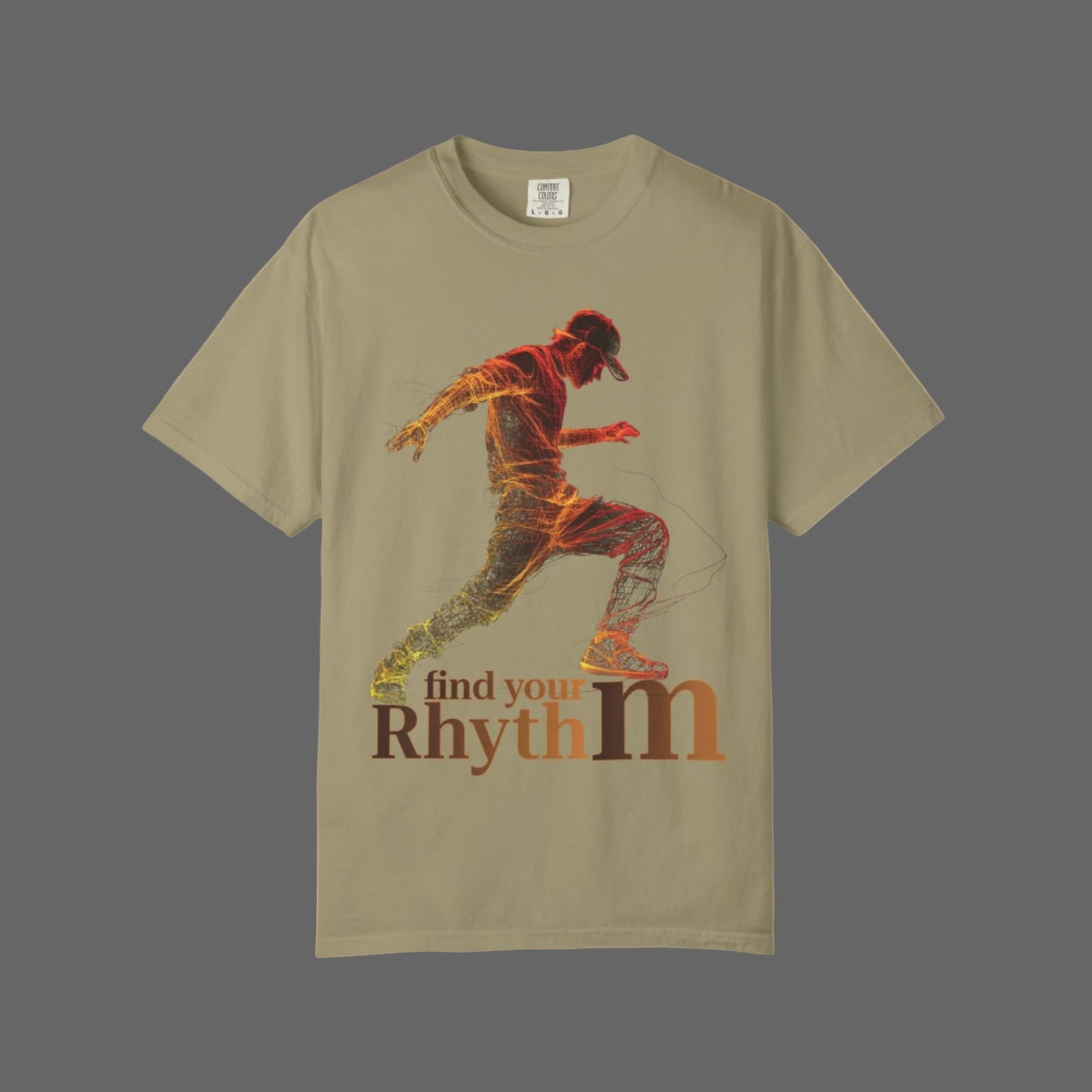 Beige t-shirt with a graphic of a person dancing and 'find your rhythm' text on a white background