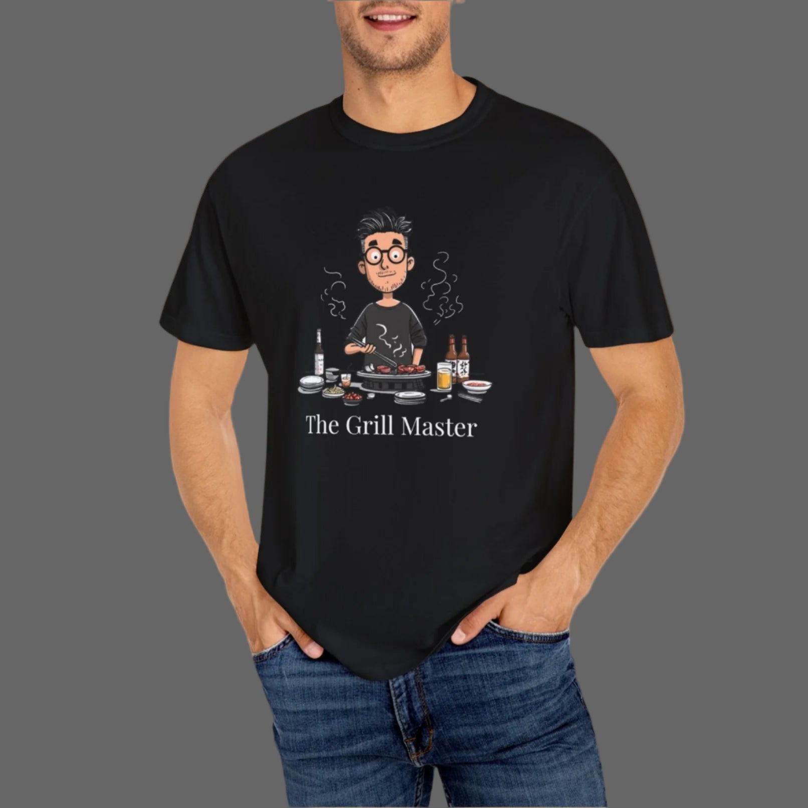 Man wearing a black t-shirt with 'The Grill Master' graphic design on a white background