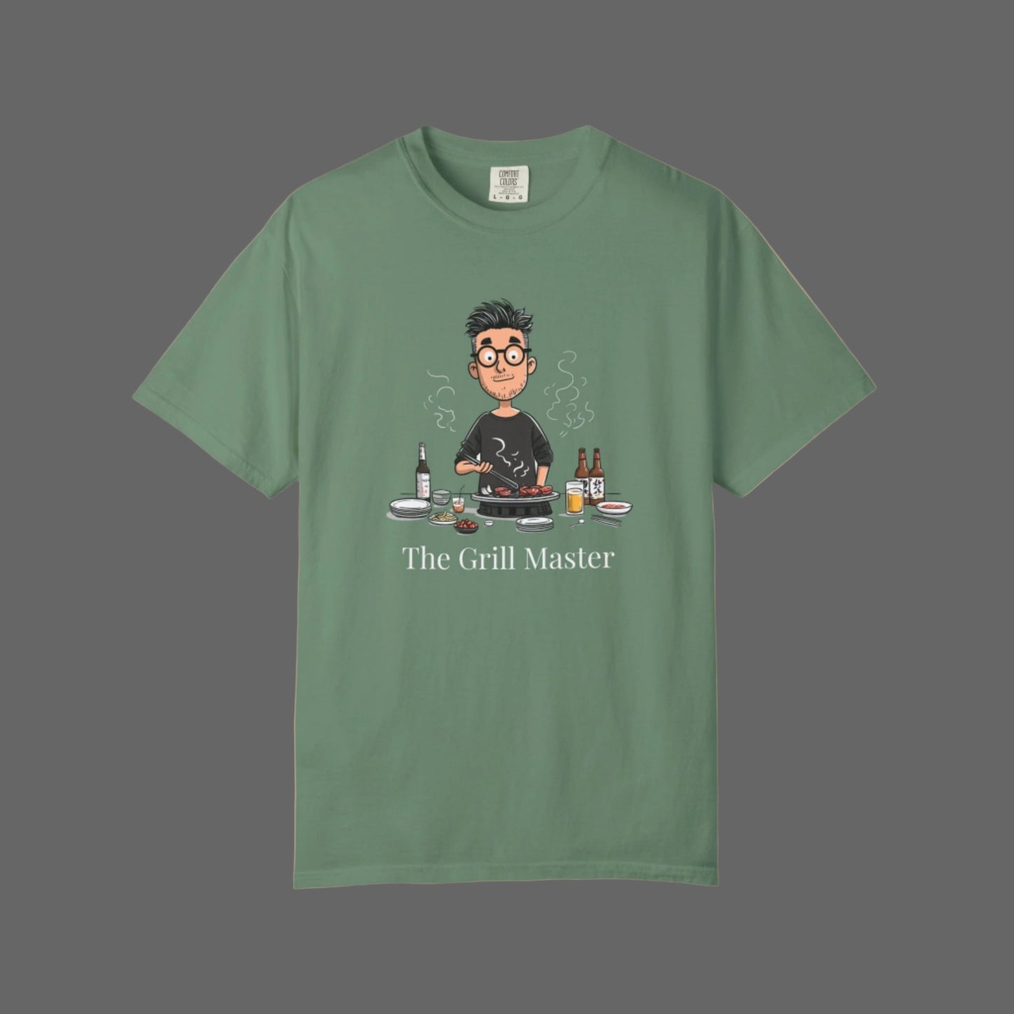 Green t-shirt with 'The Grill Master' graphic on a white background