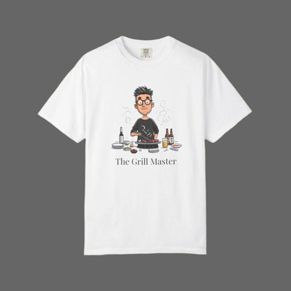 White t-shirt with a graphic of a person cooking and text 'The Grill Master' on a white background