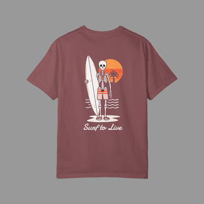 Maroon t-shirt with a skeleton holding a surfboard graphic on the back, set against a white background.