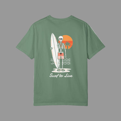 Green t-shirt with a skeleton holding a surfboard design on a white background