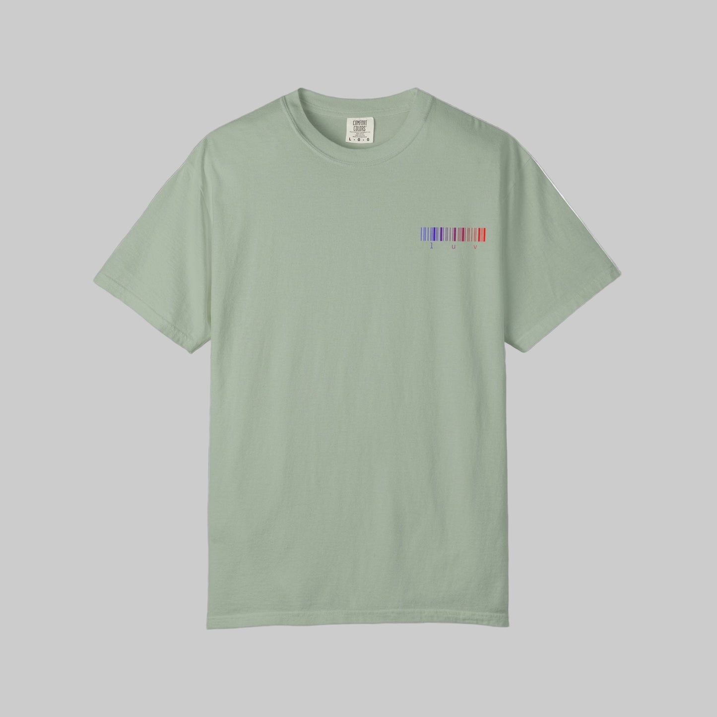Light green t-shirt with a small colorful logo on a white background