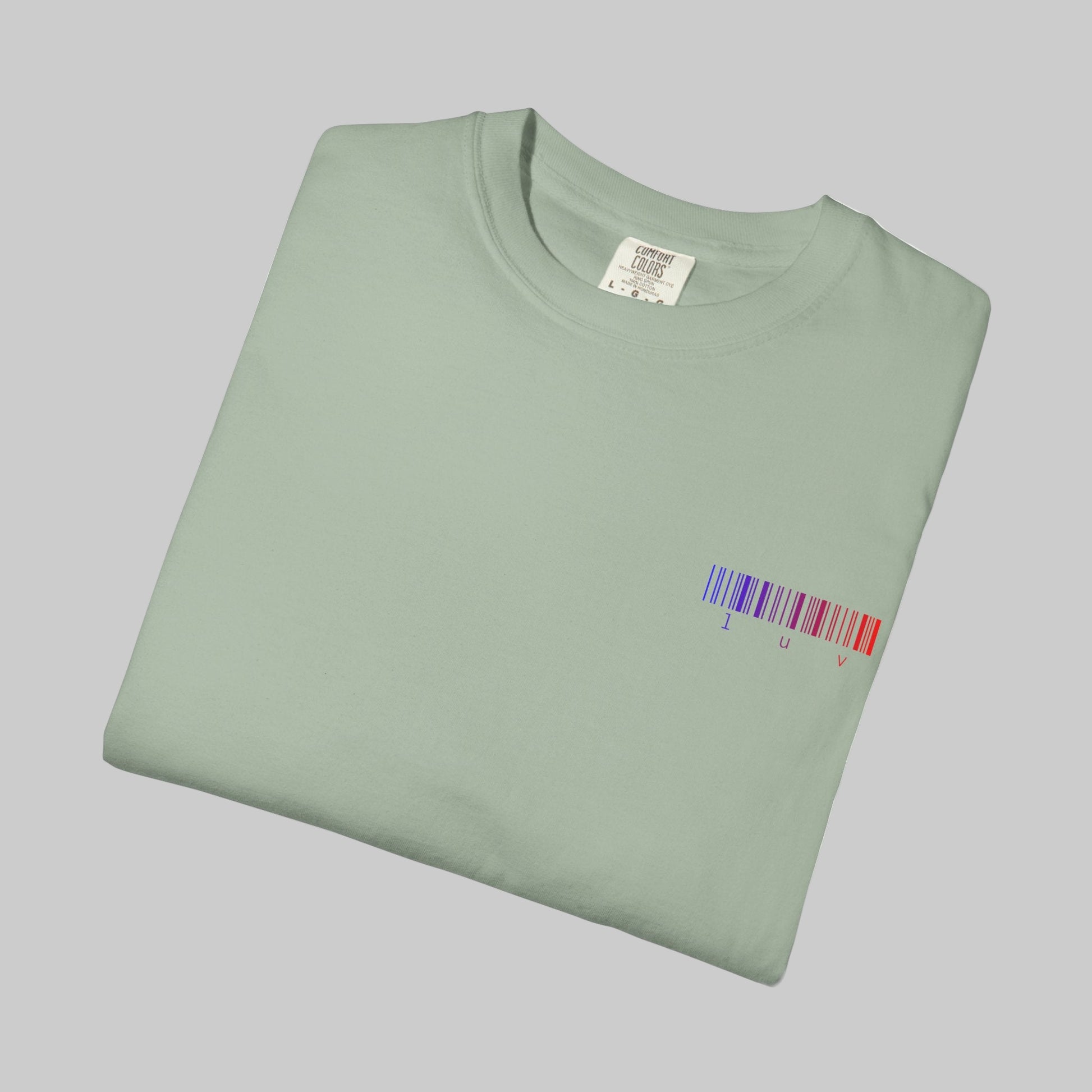 Folded light green t-shirt with a barcode design on a white background