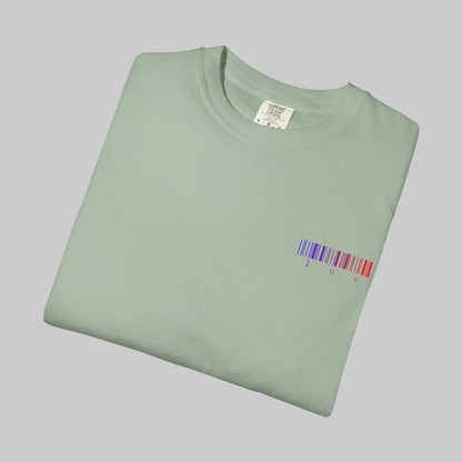 Folded light green t-shirt with a barcode design on a white background