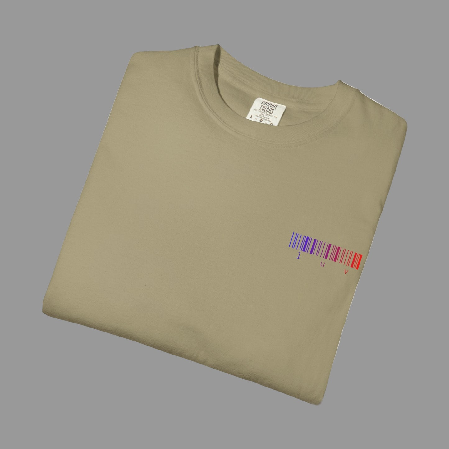 Folded beige t-shirt with a colorful barcode design on a white background