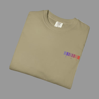 Folded beige t-shirt with a colorful barcode design on a white background