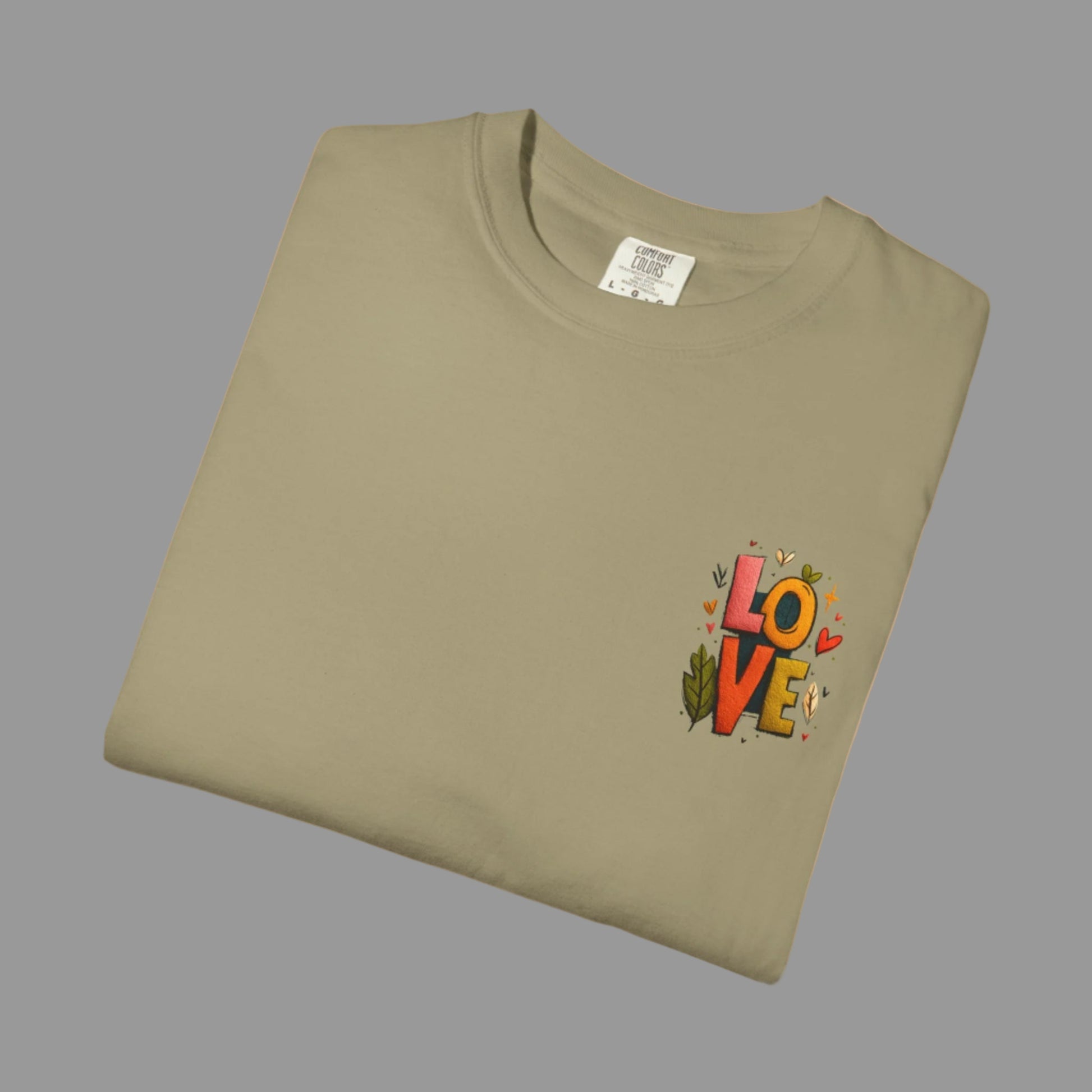 Folded khaki t-shirt with 'LOVE' design on a white background