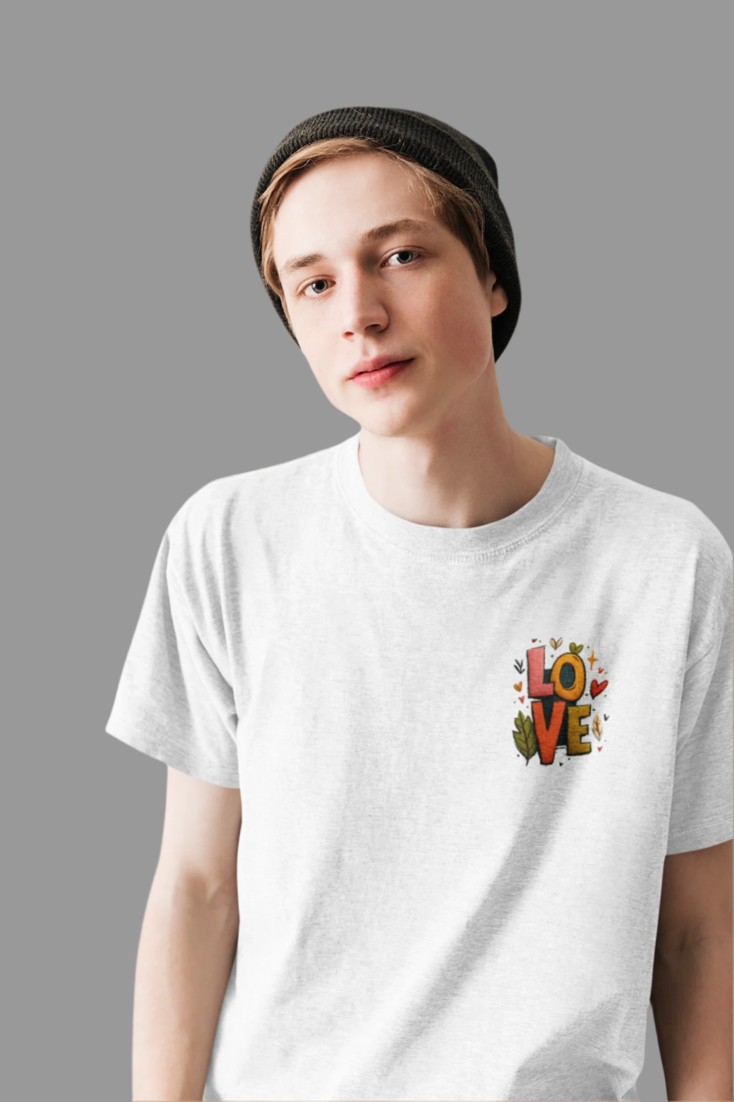 Person wearing a white t-shirt with a colorful 'LOVE' design on a light blue background