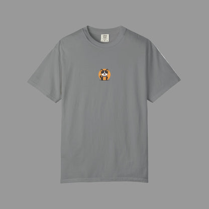 Blue t-shirt with a small dog graphic on a white background