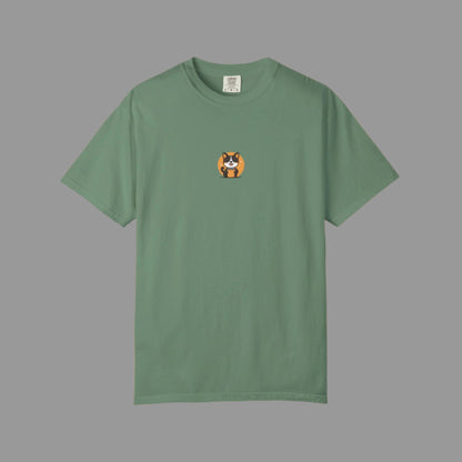 Green t-shirt with a small orange and black design on a white background