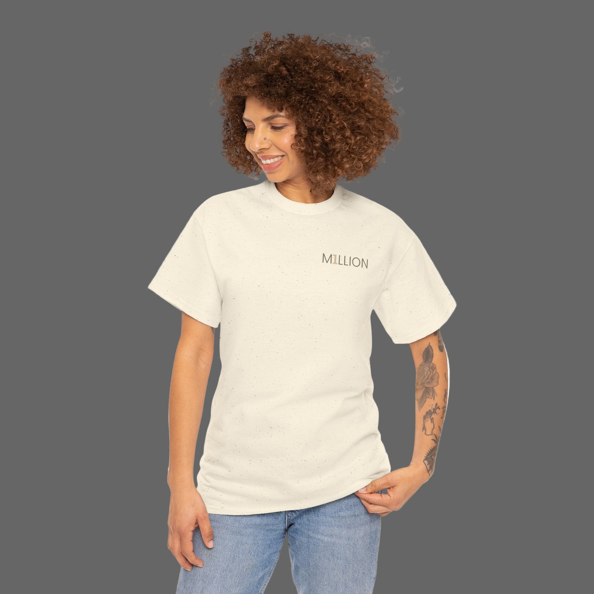Woman wearing a beige t-shirt with 'MILLION' printed on it against a white background