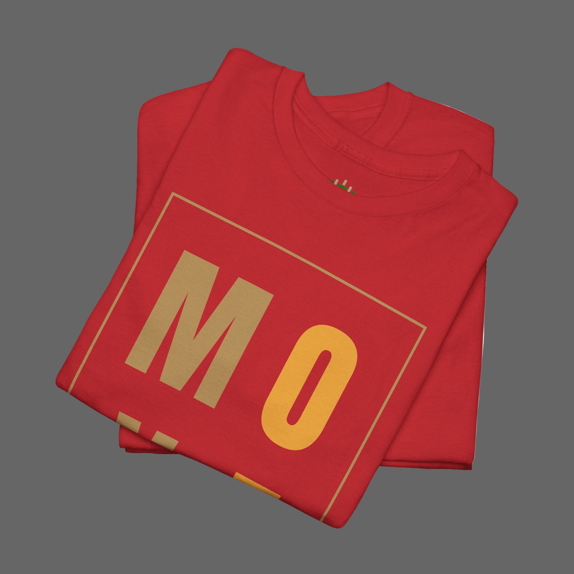 Folded red sweatshirt with 'MO' printed on it against a white background