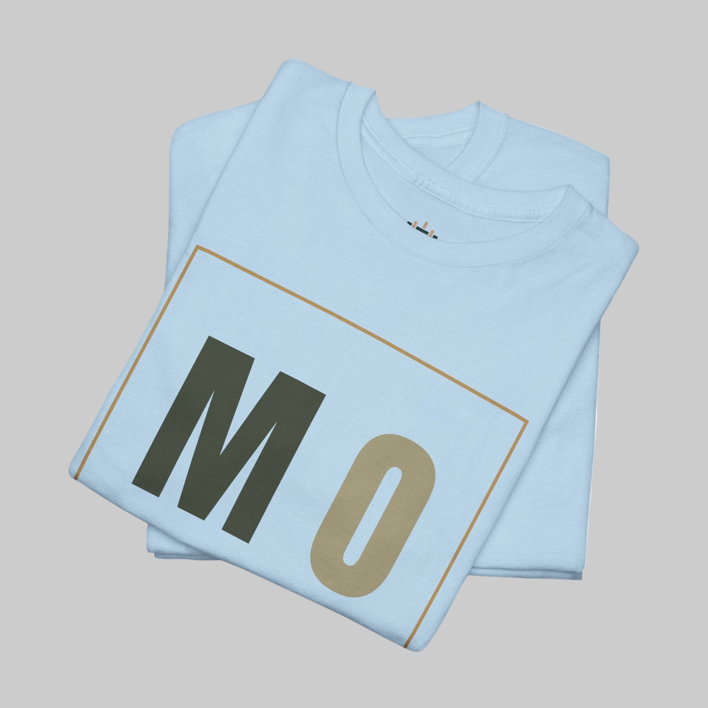 Light blue t-shirt with 'MO' printed on it, folded and displayed against a white background