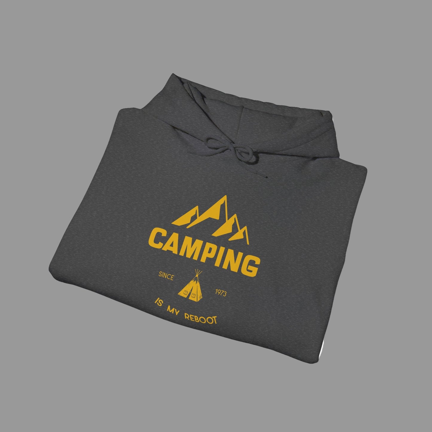 Folded gray hoodie with yellow 'Camping' graphic on a white background