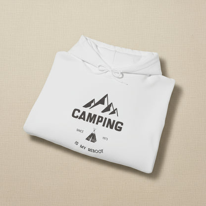 Folded gray hoodie with 'Camping is my reboot' text and mountain graphic on a white background