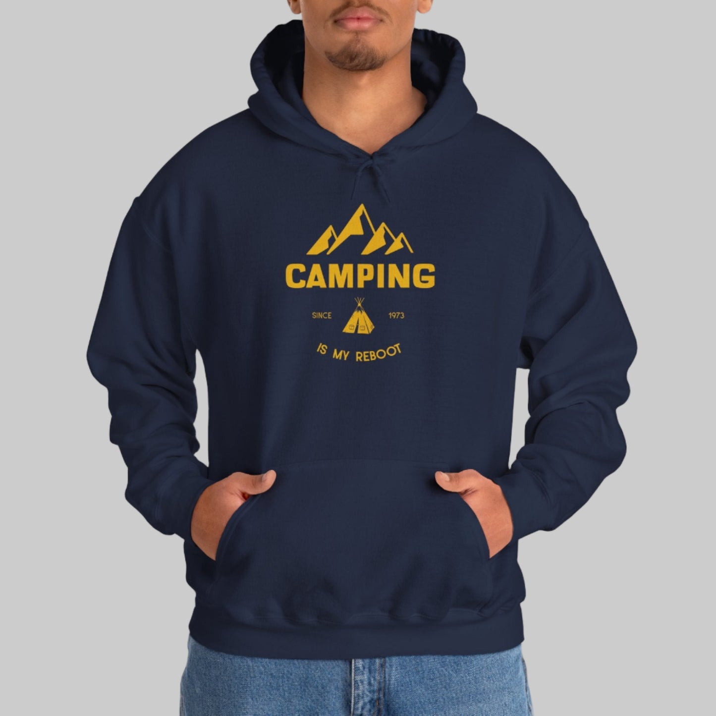 Person wearing a navy hoodie with yellow 'Camping is my Rescue' design on a white background