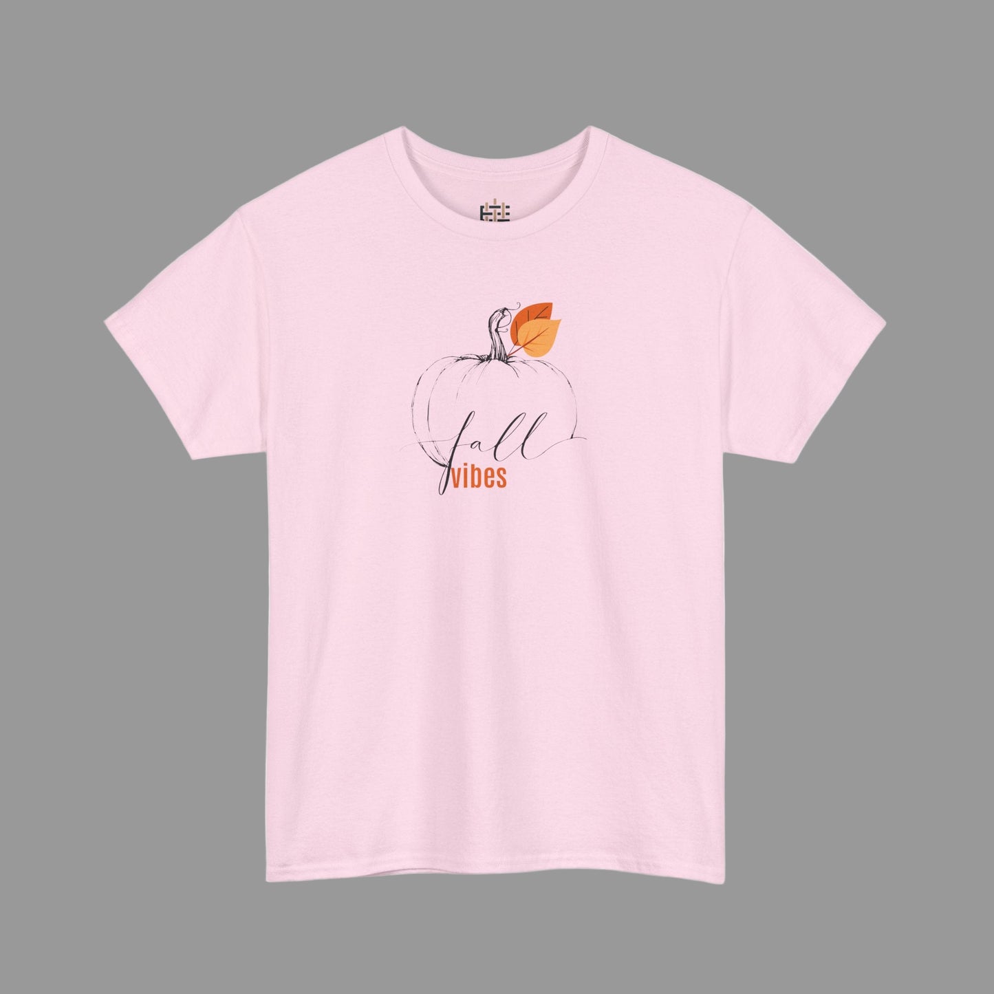 Pink t-shirt with a pumpkin and 'Fall Vibes' text on a white background