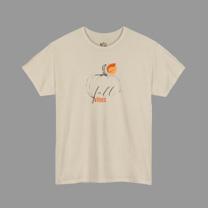 Beige t-shirt with a pumpkin graphic and 'fall vibes' text on a white background