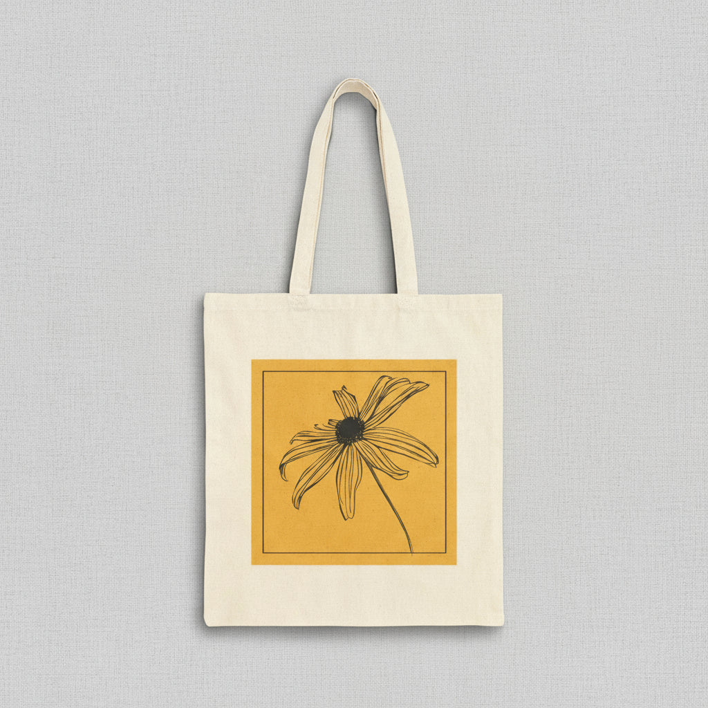 Tote bag with a black and white flower design on a yellow background