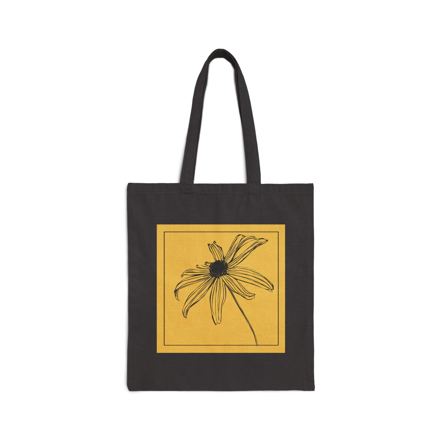 Black tote bag with a yellow square featuring a flower design on a white background