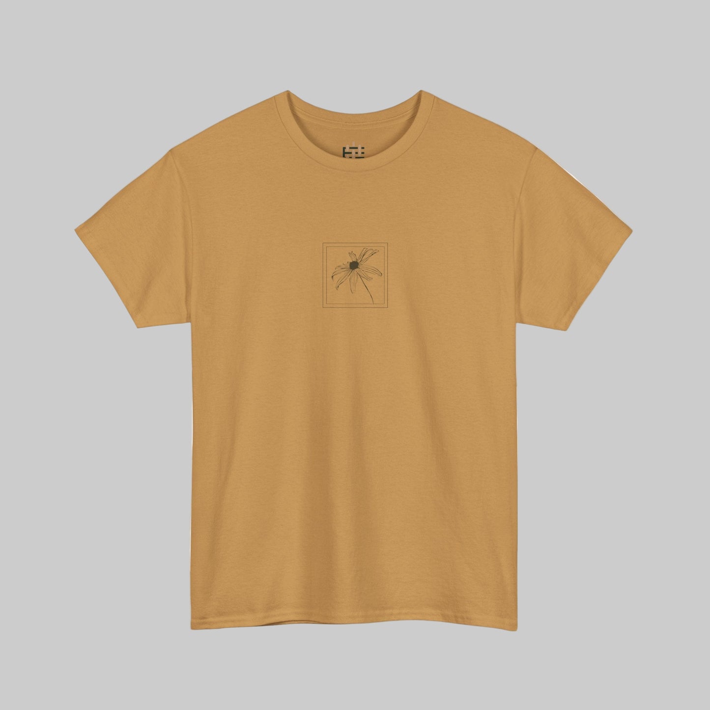 Mustard yellow t-shirt with a small graphic on a white background