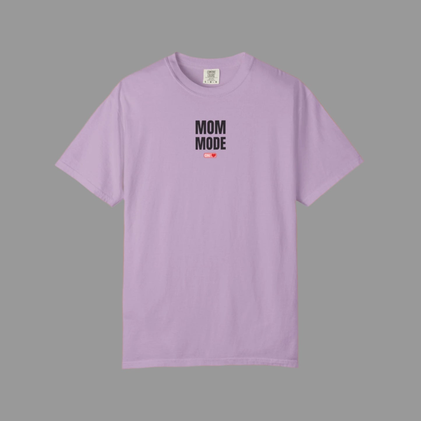 Purple t-shirt with 'Mom Mode' text on a white background