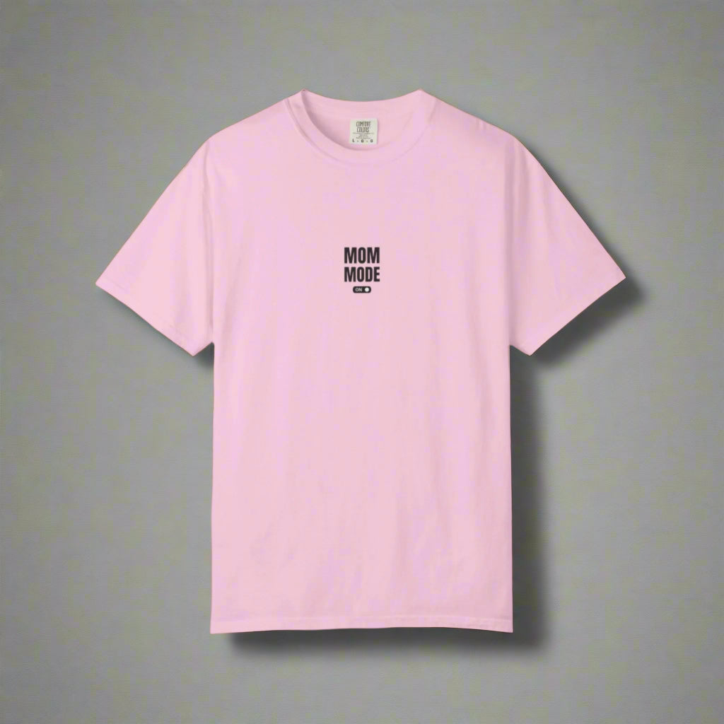 Pink t-shirt with 'MOM MODE' text on a white background