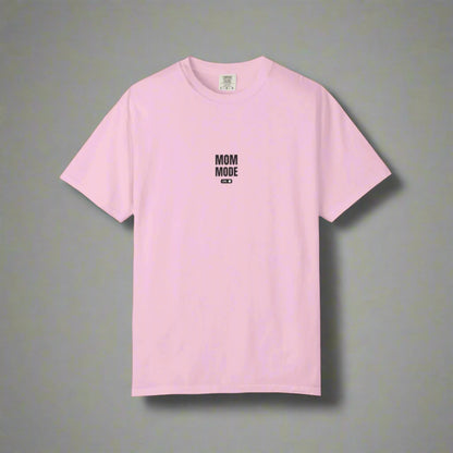 Pink t-shirt with 'MOM MODE' text on a white background