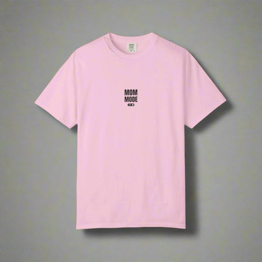 Pink t-shirt with 'MOM MODE' text on a white background