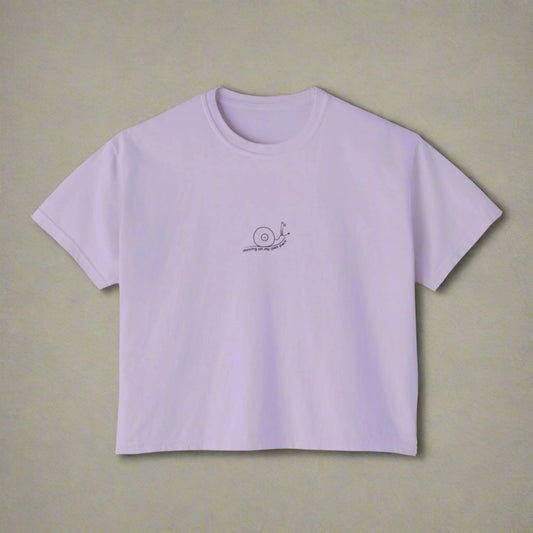Lavender t-shirt with a small logo on a white background