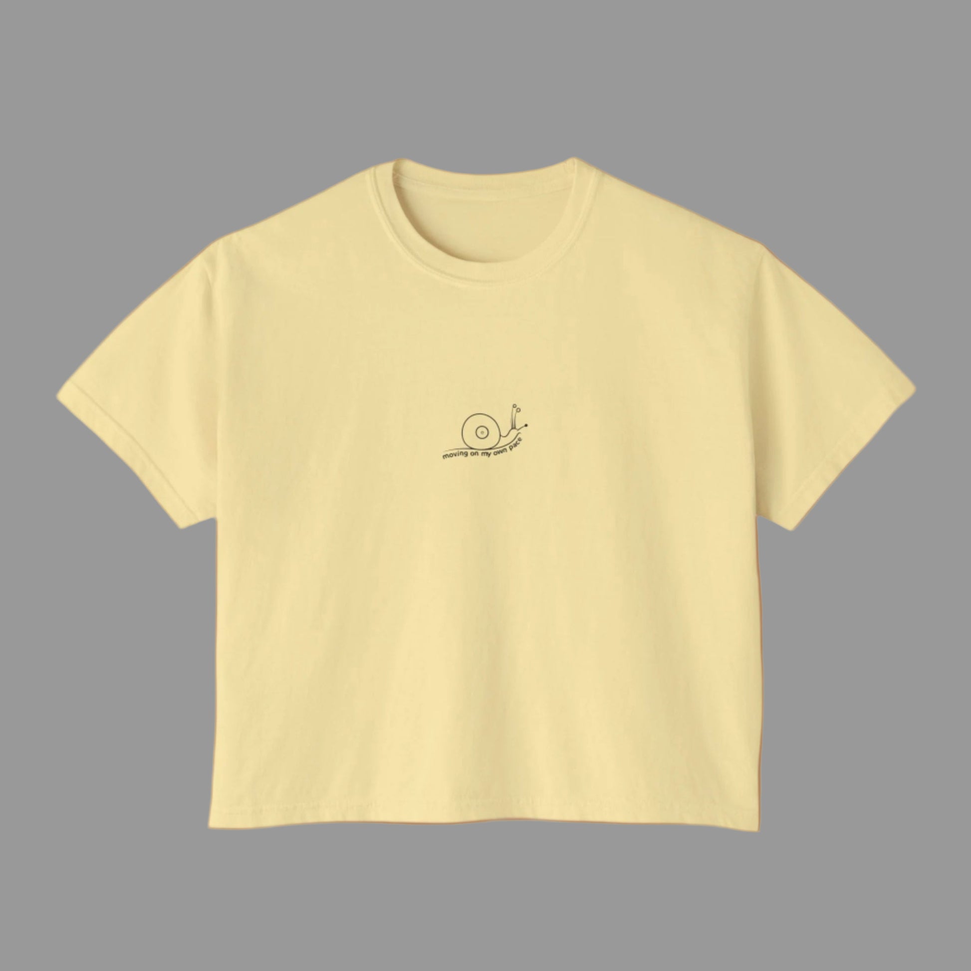 Yellow t-shirt with a small logo on a white background