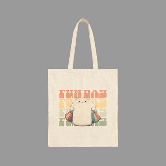 Tote bag with a cartoon character holding a rainbow umbrella and 'FUN DAY' text on a white background