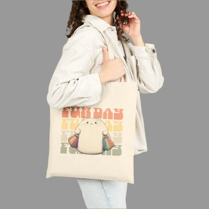 Woman holding a tote bag with a cartoon character and text on a white background