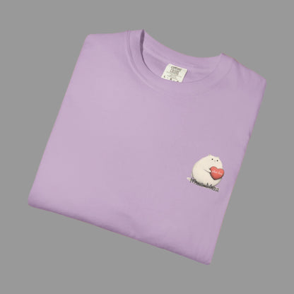 Folded purple t-shirt with a small graphic on a white background