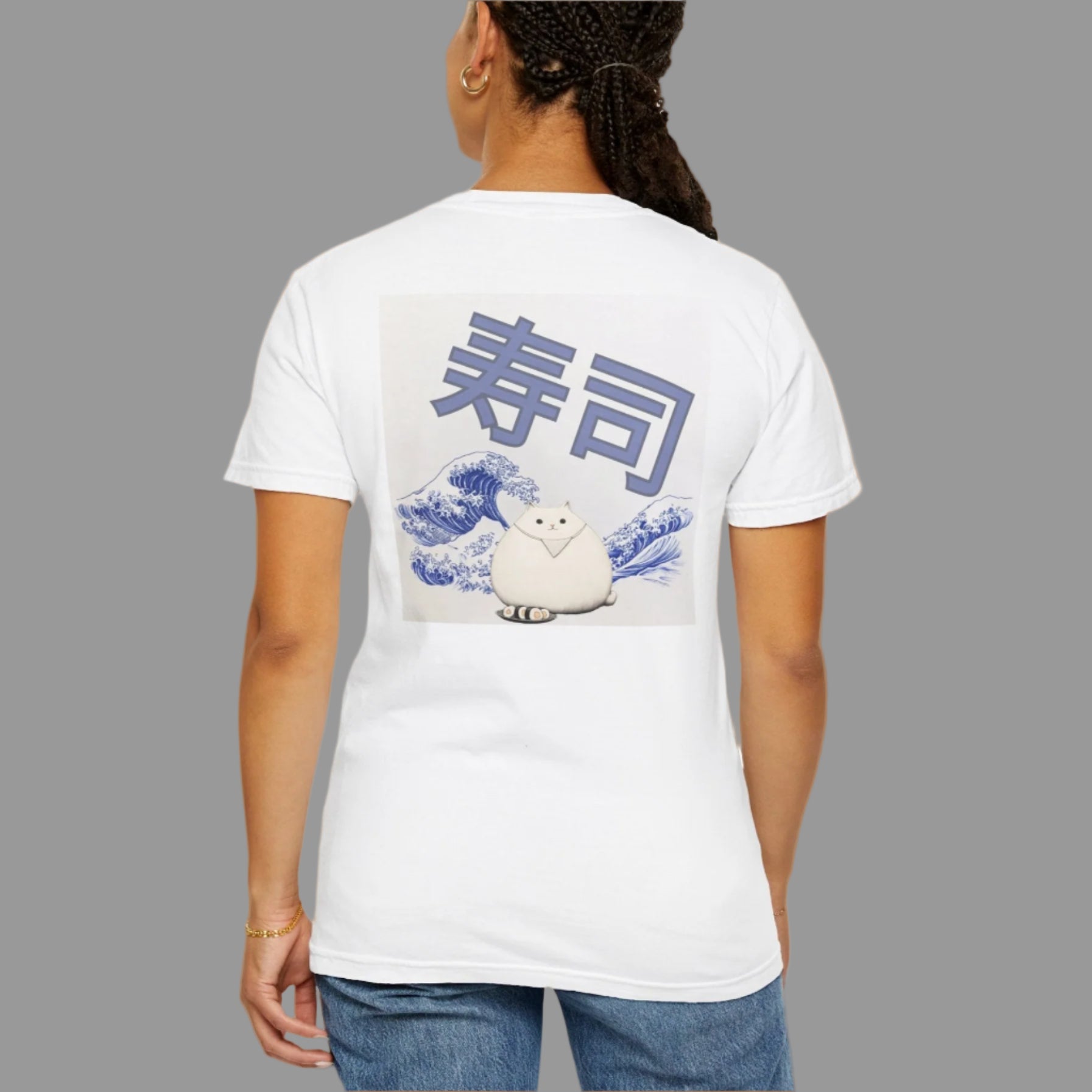 Person wearing a white t-shirt with a graphic design on the back
