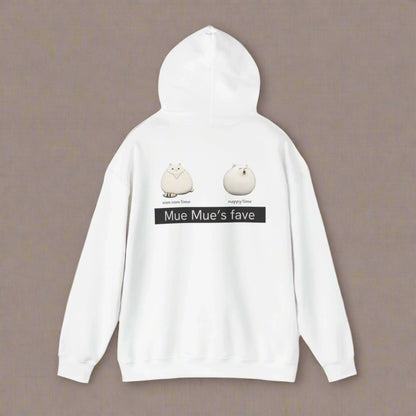 A person wearing a white hoodie with a graphic design on the back, featuring two cartoon cats and the text 'Mue Mue's fave'.